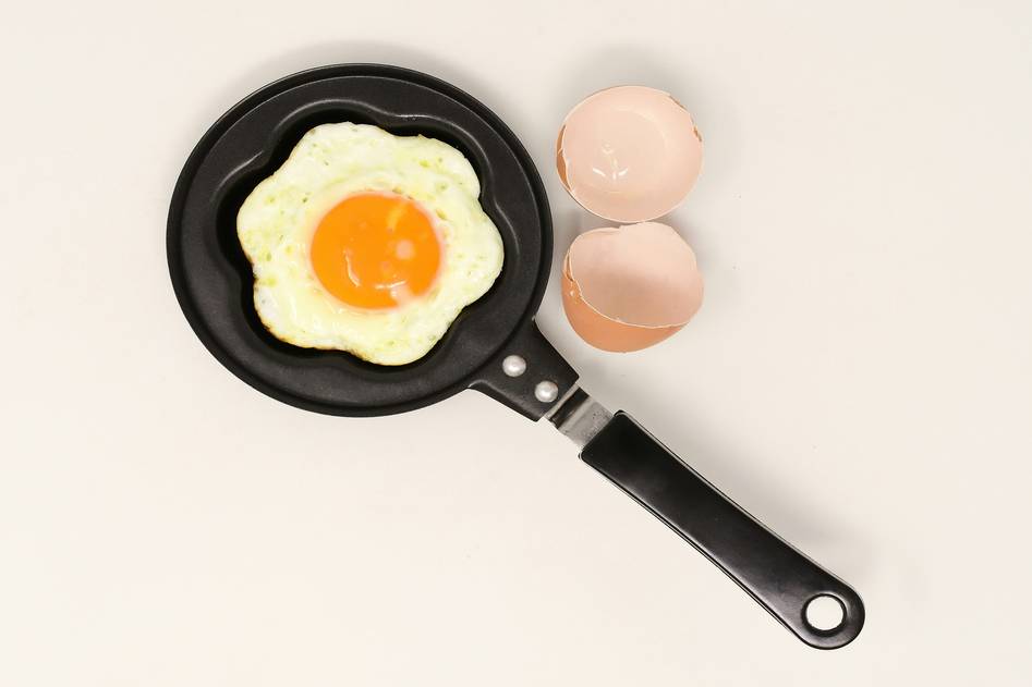 Cozy kitchen scene showcasing an egg poacher and fresh ingredients