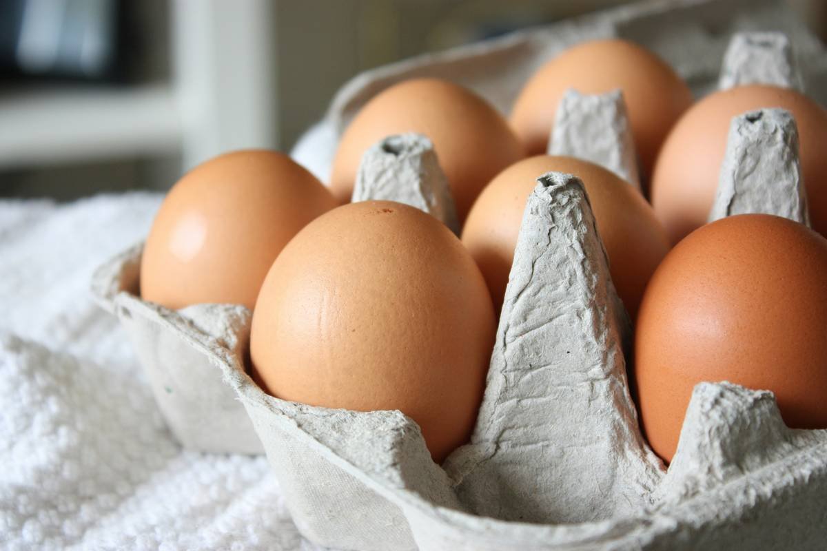 Close-up of poached eggs using silicone egg poacher showing clean release and glossy yolk
